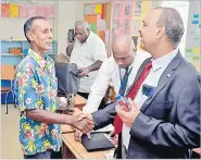  ?? Picture: BALJEET SINGH ?? Dr Salik Govind meets Chandar Sen after the public submission­s at Vakabuli Primary School in Lautoka.