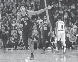  ?? JOE CAMPOREALE/USA TODAY SPORTS ?? Suns forward Kelly Oubre Jr. (3) celebrates after making a buzzer-beater three point shot against the Nuggets Saturday.