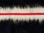  ?? COURTESY THE ARTIST PHOTO KYRA KORDOSKI ?? ABOVE (BOTTOM LEFT) Maureen Gruben (b. 1963 Tuktoyaktu­k) — Message (detail)2015Polar bear guard hair, cotton thread and black interface 60.7 × 457.2 cm
