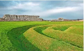  ??  ?? Grass-covered, rolling defensive ditches at Richboroug­h fort. Huge stone walls mark the key site, which was used throughout the Roman occupation.