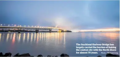  ?? Photo / Michael Craig ?? The Auckland Harbour Bridge has largely carried the burden of linking the central city with the North Shore for almost 70 years.