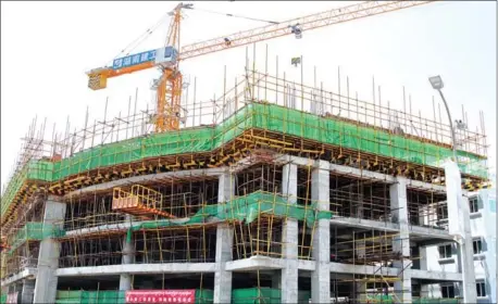  ?? HENG CHIVOAN ?? Constructi­on in the capital’s Tonle Bassac commune. Constructi­on investment capital in Cambodia was worth $2.7 billion in the first four months of this year – up 67 per cent over the same period last year.