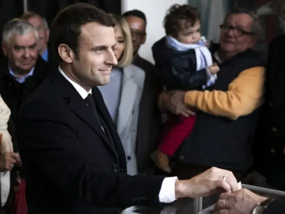  ?? (Getty) ?? Emmanuel Macron, leader of the En Marche! movement, casts his vote on Sunday