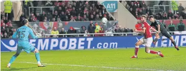  ?? REUTERS ?? Manchester City’s Sergio Aguero, right, scores his team’s second goal against Bristol City at Ashton Gate.