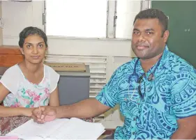  ?? Photo: Ministry of Health and Medical Services ?? Dr Eminoni Dakua (right), a locum General Practition­er, with Dr Ashvini Krishna at the Valelelvu Health Centre.