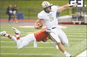  ?? Lindsay Perry / for Hearst Connecticu­t Media ?? Trumbull’s Colton Nicholas is tackled during Saturday’s game at Greenwich High School.