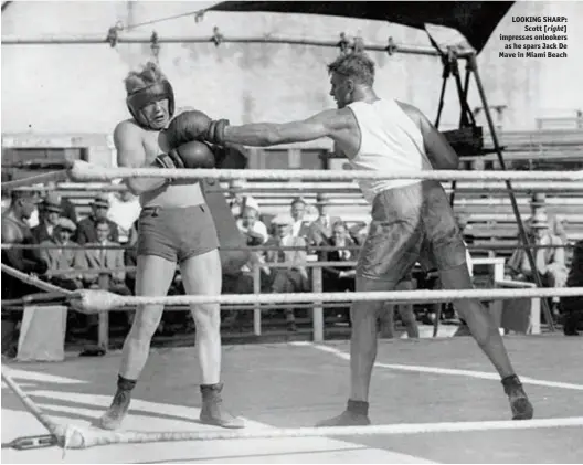  ?? Photo: LARRY BRAYSHER ?? LOOKING SHARP: Scott [right] impresses onlookers as he spars Jack De Mave in Miami Beach