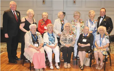  ??  ?? Surviving Canadian war brides are joined by Lt. Gov. Tom Molloy (left) and Moose Jaw Mayor Fraser Tolmie during their eight annual reunion banquet at Temple Gardens on June 23.