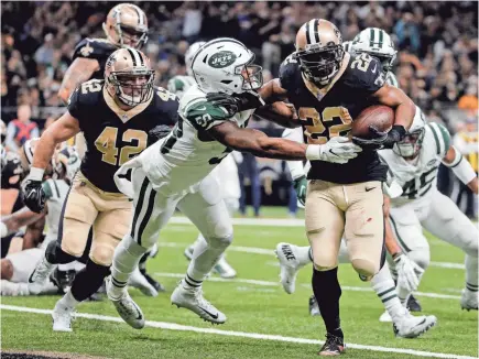  ??  ?? Saints running back Mark Ingram, getting past Jets inside linebacker Darron Lee for a 1-yard TD run, also had a 50-yard TD run and a 54-yard reception Sunday on his way to 151 yards from scrimmage. DERICK E. HINGLE/USA TODAY SPORTS