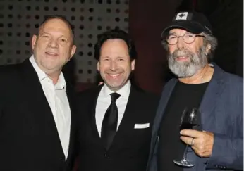  ?? DAVE ALLOCCA/STARPIX ?? Barry Avrich, centre, with Harvey Weinstein, left, and Michael Cohl at a 2016 party that Weinstein hosted.