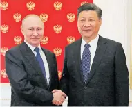  ?? AFP ?? Xi Jinping visita Rusia. Aquí, en el saludo a Putin.