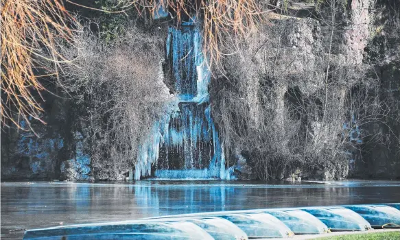  ?? Picture: AFP/FREDERICK FLORIN ?? A frozen waterfall hangs above a lake in the Orangerie Park in Strasbourg, in eastern France.