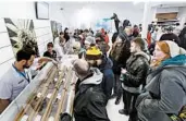  ?? JOHN WOODS/THE CANADIAN PRESS ?? Consumers in Canada check out the sample counter at a cannabis store Oct. 17 in Winnipeg, Manitoba.