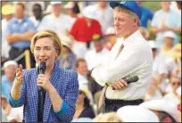  ?? DENNIS COOK/ASSOCIATED PRESS ?? In March 1994, Hillary Clinton, accompanie­d by President Bill Clinton, responded to a question during a health care forum for senior citizens in Deerfield Beach, Fla.
