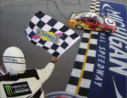  ?? CHRIS TROTMAN — NASCAR VIA AP ?? Kyle Larson takes the checkered flag to win the NASCAR Cup Series FireKeeper­s Casino 400race at Michigan Internatio­nal Speedway, Sunday in Brooklyn, Mich.