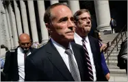  ?? AP PHOTO BY MARY ALTAFFER ?? Republican U.S. Rep. Christophe­r Collins, center, leaves federal court, Wednesday, Aug. 8, in New York.