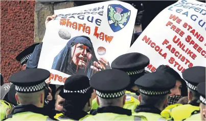  ?? Picture: Getty. ?? Police surroundin­g the right wing SDL during a demonstrat­ion.