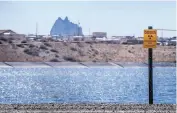  ?? ROBERTO E. ROSALES/JOURNAL ?? This retention pond next to the former site of a mill in Shiprock is among the types of sites that will be investigat­ed as part of research on toxic mine waste.