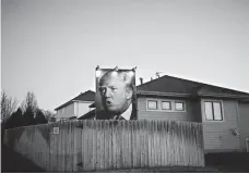  ?? CHRISTOPHE­R FURLONG, GETTY IMAGES ?? A poster of Republican presidenti­al candidate Donald Trump in the backyard of a supporter in West Des Moines in January.