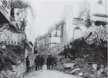  ?? Contribute­d ?? In this August 1916 photo, Gen. Sir Sam Hughes and an unidentifi­ed group look at ruins in Arras, France during the First World War.