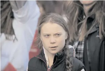  ??  ?? Swedish environmen­tal activist Greta Thunberg participat­es in a student-led climate change march in Vancouver in October 2019.