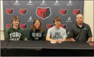  ?? PHOTO COURTESY BOYERTOWN ATHLETICS ?? Boyertown’s Cy Evans signed his national letter of intent to continue his academic and running careers at York College of PA. Also on-hand for his signing were, from left, brother Levi Evans, alogn with his parents Kim and Tim Evans.
