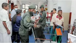  ?? ?? Scenes at the National Hospital and Kalubowila hospital during last week's token strike. Pix by Akila Jayawarden­a and Indika Handuwala