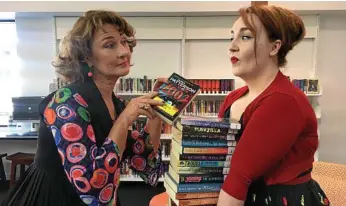  ?? PHOTO: CONTRIBUTE­D ?? READING LIST: Talking about the most popular books at the Toowoomba City Library are librarians Carmel Stuart (left) and Angela Morgan.