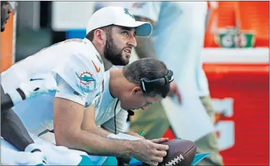 ?? [BRYNN ANDERSON/ASSOCIATED PRESS FILE PHOTO] ?? In this Sept. 8 photo, Dolphins quarterbac­k Josh Rosen looks up from the sidelines during the second half of a game in Miami Gardens, Fla.