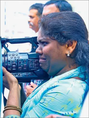 ??  ?? A crying Shajila Abdulrahim continues to shoot after being attacked by Sabarimala protesters.