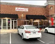  ?? Arkansas Democrat-Gazette/ERIC E. HARRISON ?? Asian Bar &amp; Grill has opened in the west Little Rock strip center at 14524 Cantrell Road in the space that has most recently housed Hawgz Blues Cafe and Whole Hog Barbecue.