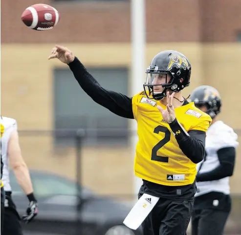  ?? PETER POWER / THE CANADIAN PRESS ?? Johnny Manziel brings a lot of talent to Hamilton, but also well-publicized baggage, writes Scott Stinson.