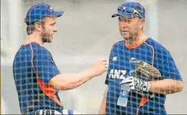  ?? PTI ?? New Zealand captain Kane Willamson speaks to batting coach Craig McMillan during a practice session at Brabourne stadium in Mumbai on Sunday.