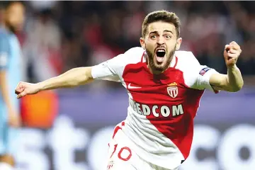  ?? — AFP photo ?? A file photo taken on March 15, 2017 at the Stade Louis II in Monaco shows Monaco's Portuguese midfielder Bernardo Silva celebratin­g after his team scored a goal during the UEFA Champions League football match Monaco and Manchester City.