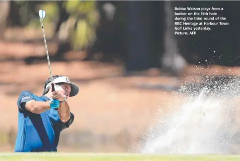  ?? Picture: AFP ?? Bubba Watson plays from a bunker on the 15th hole during the third round of the RBC Heritage at Harbour Town Golf Links yesterday.