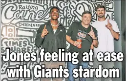  ?? Courtesy of Raising Cane’s ?? CHICKEN DANCE: Daniel Jones, attending the opening of the Raising Cane’s flagship store in Times Square with the Jets’ Garrett Wilson, is getting more comfortabl­e after receiving a four-year, $160 million contract.