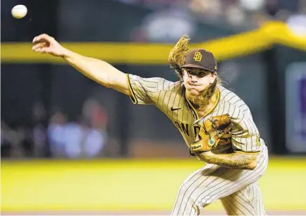  ?? MATT YORK PHOTOS AP ?? Padres starting pitcher Mike Clevinger earned his second victory of the season, going six shutout innings against the D-backs.