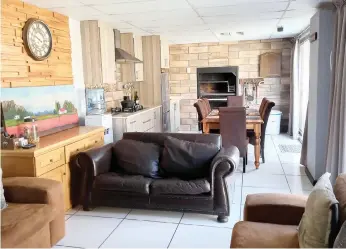  ??  ?? The luxury indoor braai area of the Paarl home to be auctioned by Rawson on September 23.