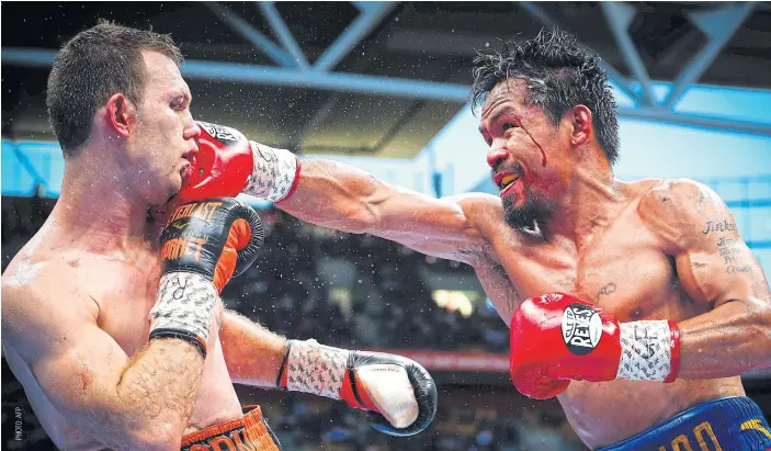  ??  ?? Manny Pacquiao, right, in action against Jeff Horn in Brisbane.