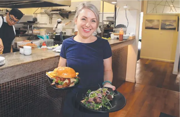  ?? Picture: JUSTIN BRIERTY ?? BUSY SHIFT: Waitress Tiara Secombe prepares to serve dishes at Vivo at Palm Cove, which is searching for apprentice and commis chefs.