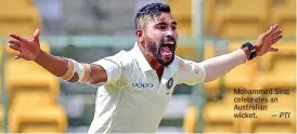  ?? — PTI ?? Mohammed Siraj celebrates an Australian wicket.