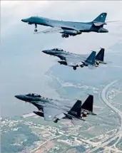 ?? SOUTH KOREAN DEFENSE MINISTRY ?? A U.S. Air Force B-1 bomber, top, flies over the Korean Peninsula on Sunday with two South Korean fighter jets.