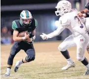  ??  ?? Jones’s Korbin Cox tries to get past Metro Christian’s Levi Korir during Friday’s high school football playoff game between Jones and Metro Christian at Jones High School. [PHOTO BY SARAH PHIPPS, THE OKLAHOMAN]