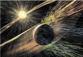  ?? Goddard Space Flight Center / NASA via Associated Press ?? An artist’s rendering shows a solar storm hitting Mars and stripping ions from the planet’s upper atmosphere. NASA’s Mars-orbiting MAVEN craft has discovered that solar storms rob the red planet of about 10 pounds of atmosphere per second.