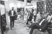  ??  ?? Cortes Williams makes a presentati­on Tuesday about NextGen Medical at the OKBio booth during the 2017 BIO event in San Diego.