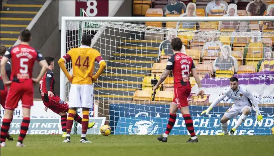  ??  ?? Liam Kelly outfoxes Jamie McGrath to save his penalty and help Motherwell to a 1-0 victory over St Mirren