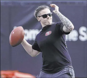  ?? Jeff Chiu The Associated Press ?? San Francisco 49ers offensive assistant coach Katie Sowers, 33, loosens up at practice on Thursday at the Super Bowl LIV-bound team’s training facility in Santa Clara, Calif.