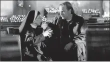  ?? Courtesy Photo ?? Kevin Costner and Linda Hunt in Dragonfly (2002).