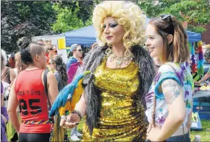  ?? GUARDIAN FILE PHOTO ?? In this June 2016 photo, Nicholas Whalen takes part in Charlottet­own’s Pride in the Park celebratio­n as his alter ego, Whatsherna­me, greeting visitors with pet parrot, Quaida.