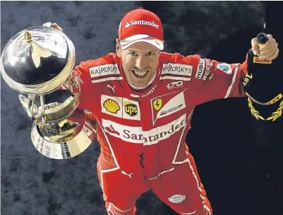  ?? Picture: Getty. ?? Ferrari’s Sebastian Vettel celebrates victory in the Bahrain Grand Prix.